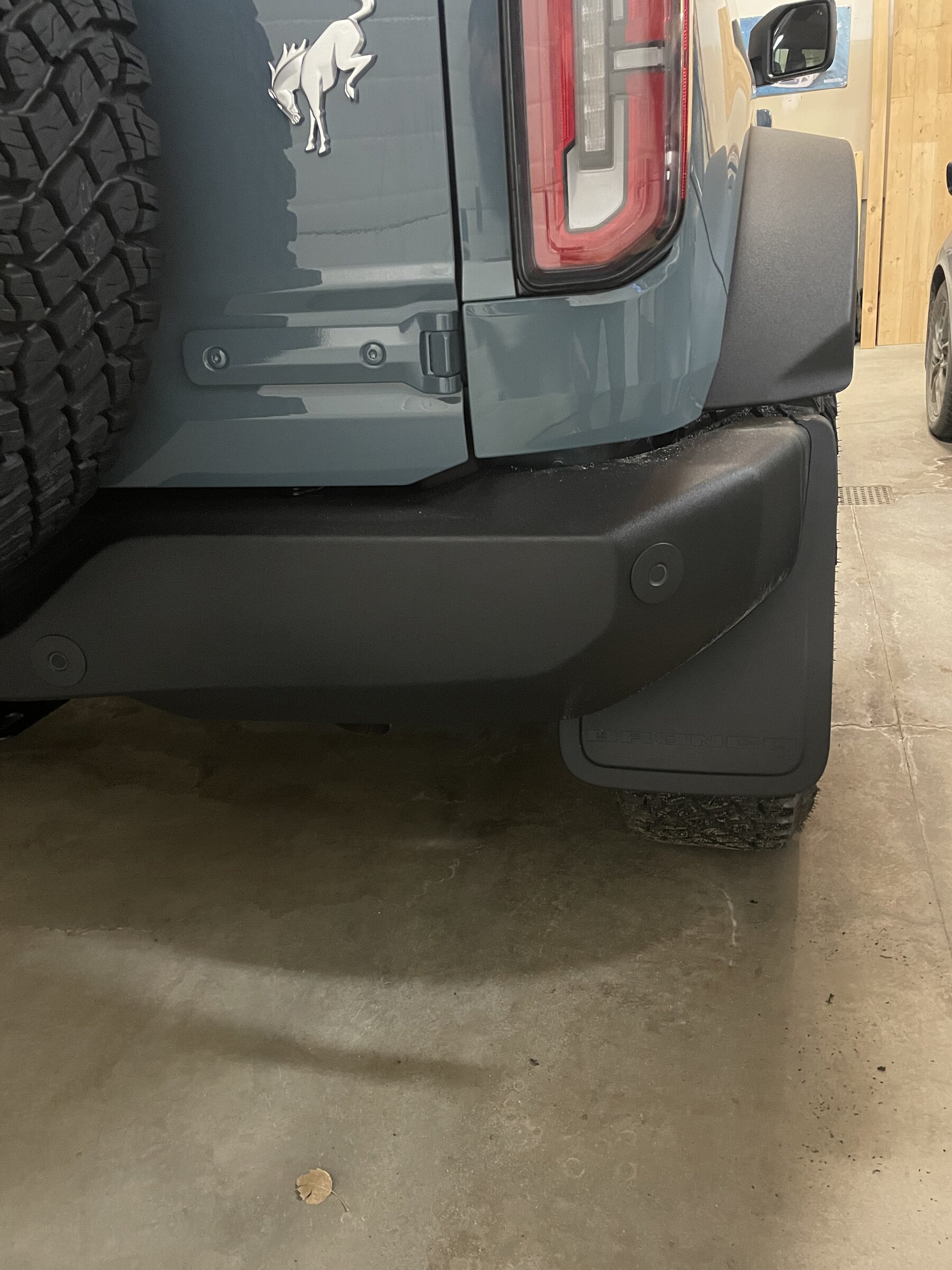 Ford Bronco Ford OEM Mud Flaps / Splash Guards trimmed to fit OBX Sasquatch with side steps IMG_9282